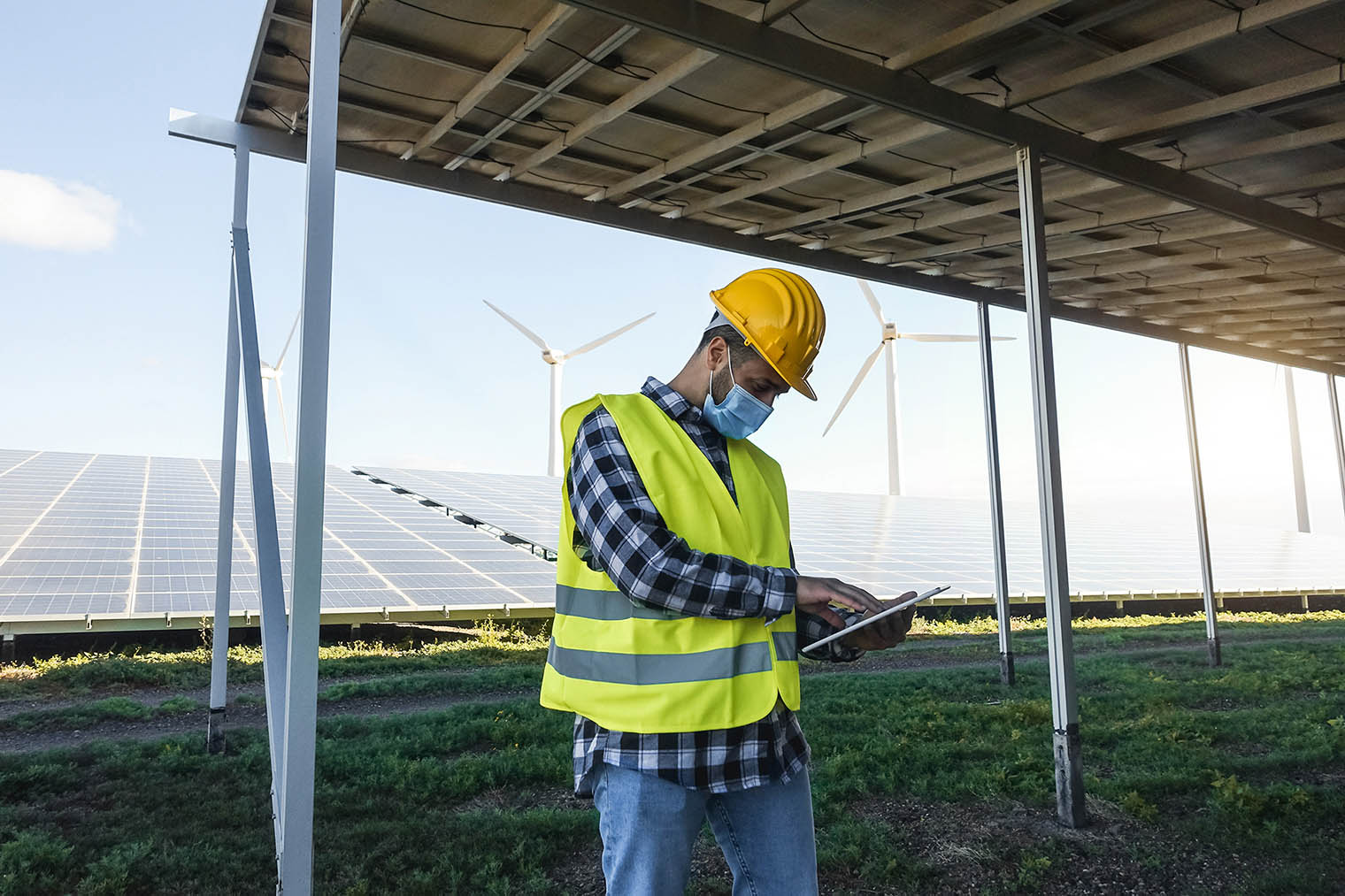 young-man-working-with-digital-tablet-at-renewable-2021-11-11-16-36-32-utc.jpg